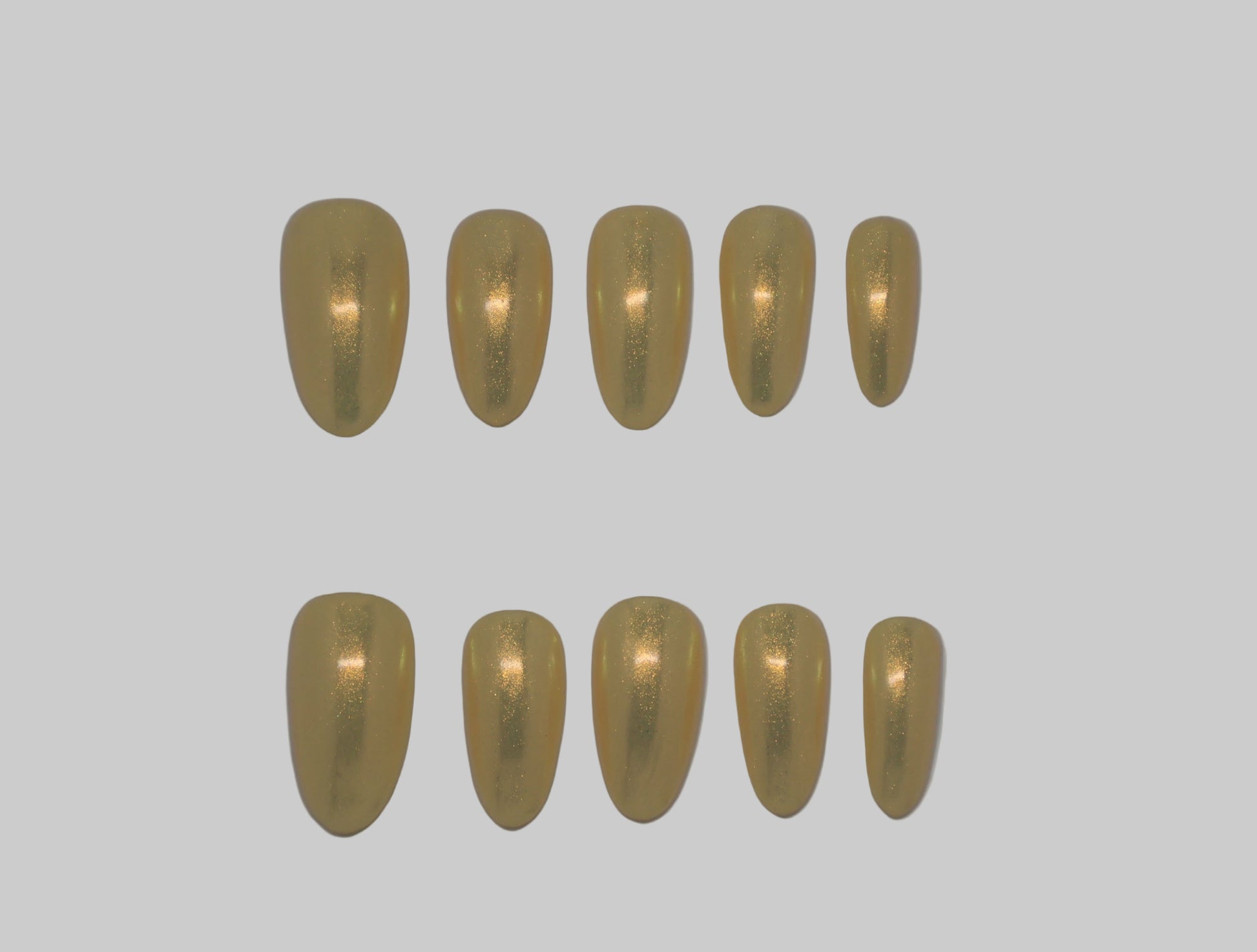 Set of Iridescent gold nails on white background