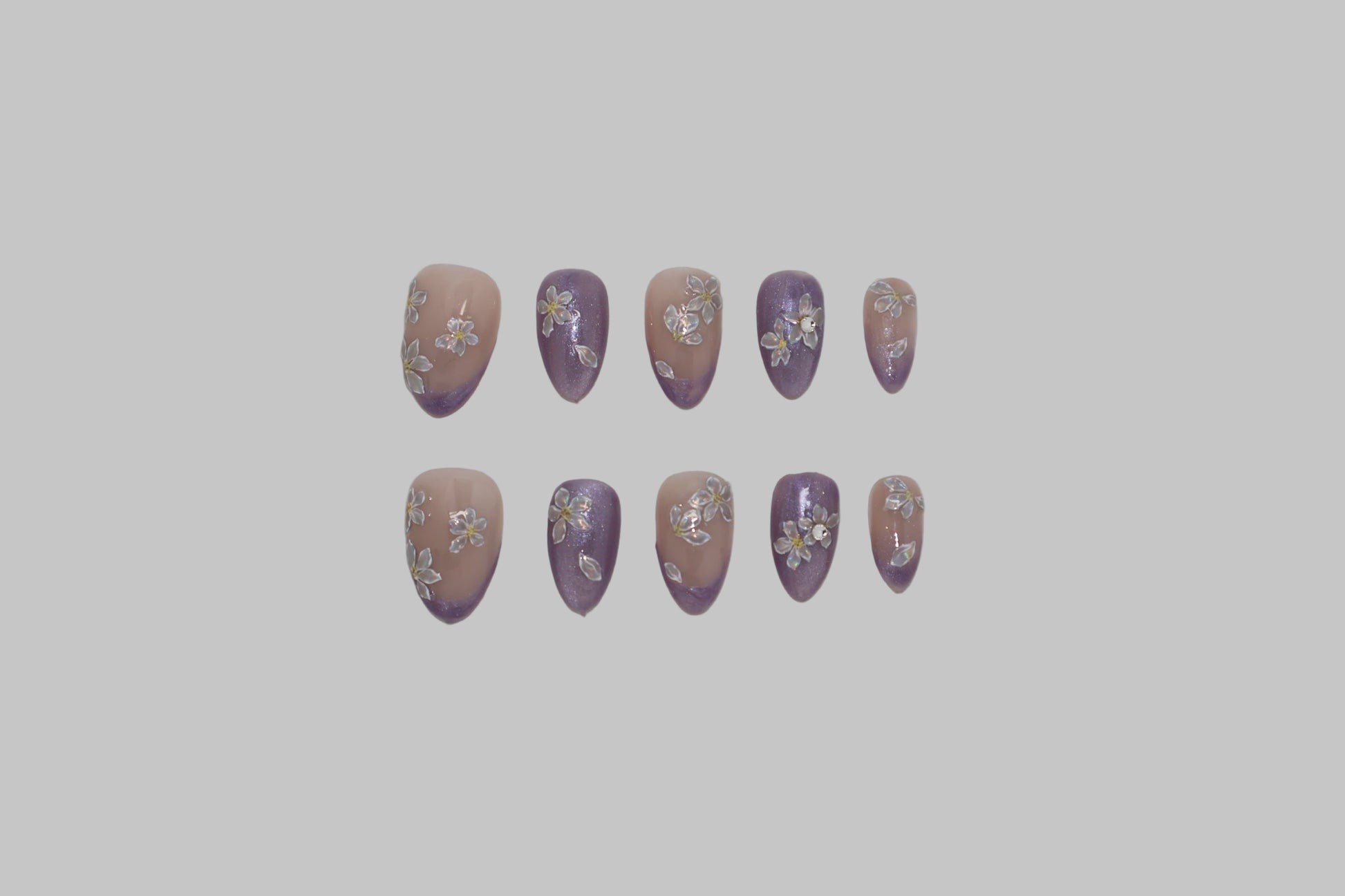 Set of purple and nude nail art designs on a white background
