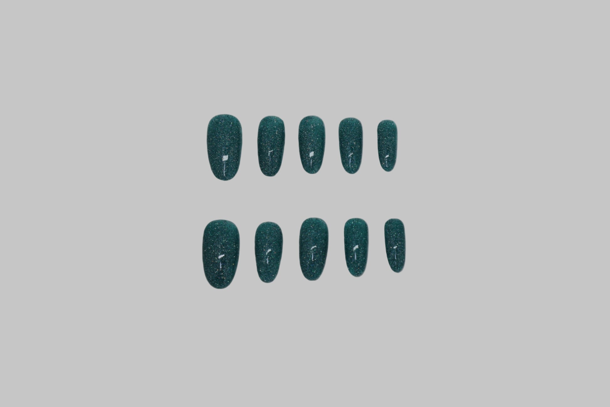 Teal glitter nails on white background